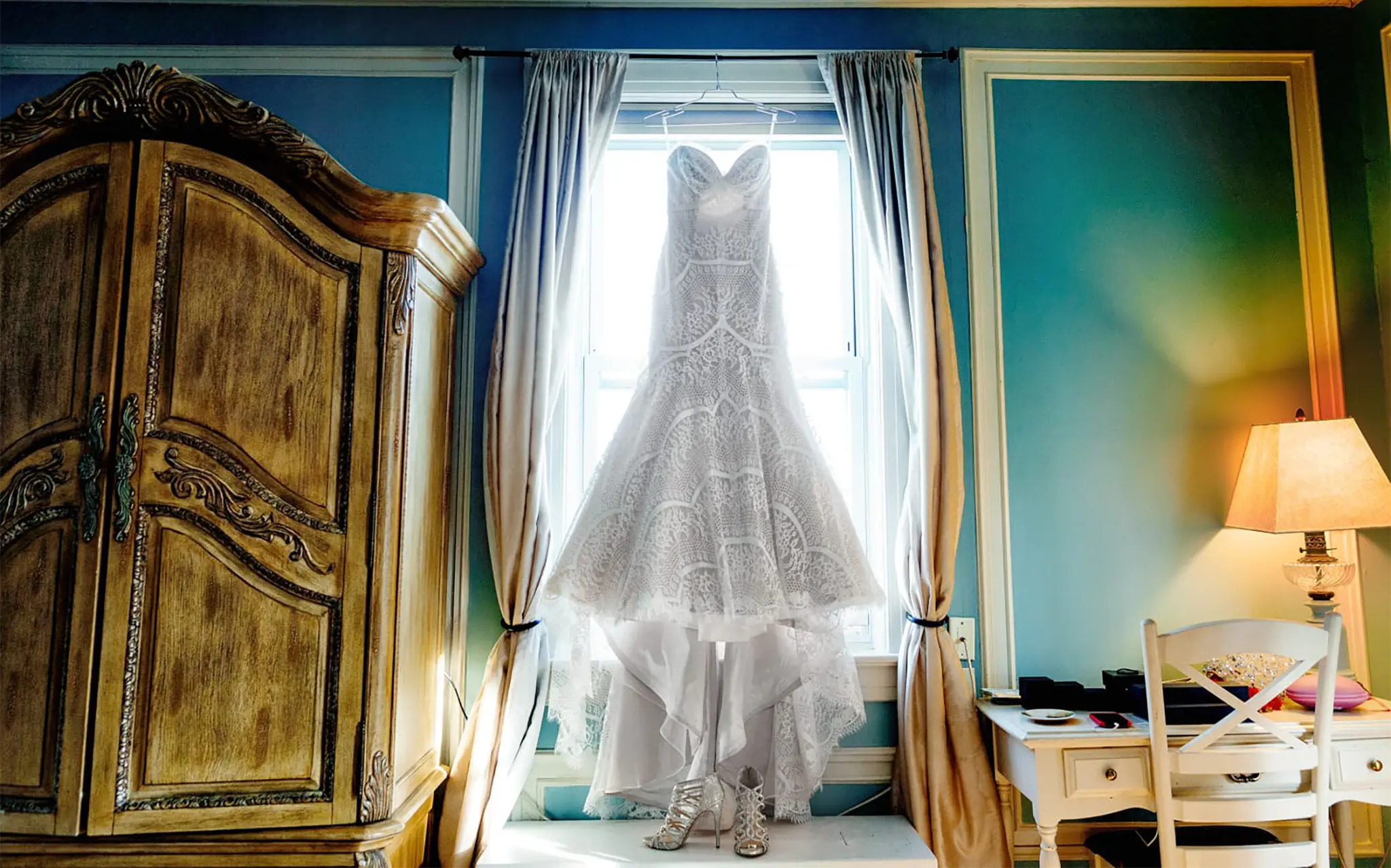 Beautiful wedding or elopement dressed hang by a large window